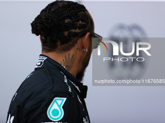 Lewis Hamilton walks in the paddock at Circuit of the Americas in Austin, Texas, on October 17, 2024. (