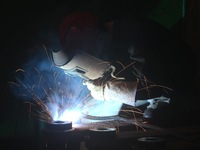 A worker welds machinery parts for export at a machinery manufacturing workshop in Hangzhou, Zhejiang province, China, on October 18, 2024....