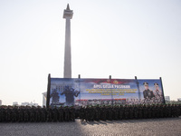 Thousands of armed forces and police personnel take part in a troop roll call at the National Monument in Jakarta, Indonesia, on October 18,...