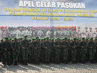 Thousands of armed forces and police personnel take part in a troop roll call at the National Monument in Jakarta, Indonesia, on October 18,...