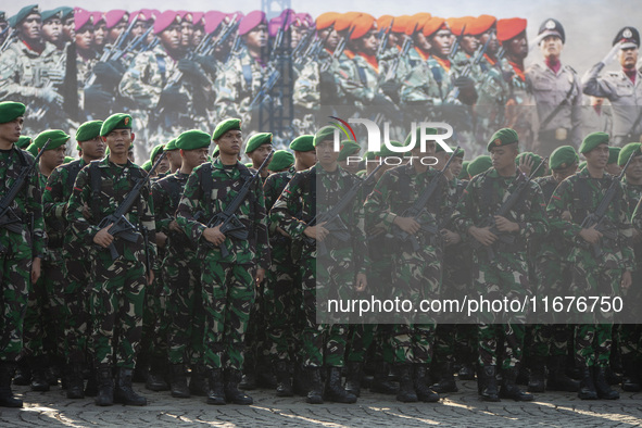 Thousands of armed forces and police personnel take part in a troop roll call at the National Monument in Jakarta, Indonesia, on October 18,...