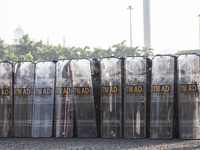 Thousands of armed forces and police personnel take part in a troop roll call at the National Monument in Jakarta, Indonesia, on October 18,...