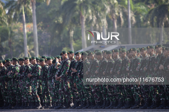 Thousands of armed forces and police personnel take part in a troop roll call at the National Monument in Jakarta, Indonesia, on October 18,...