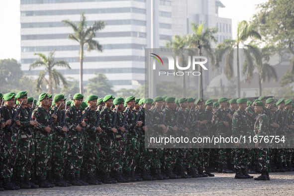 Thousands of armed forces and police personnel take part in a troop roll call at the National Monument in Jakarta, Indonesia, on October 18,...