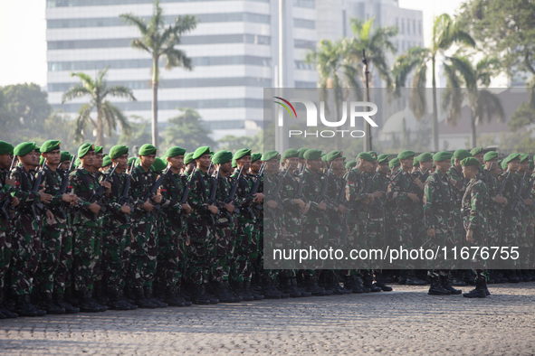 Thousands of armed forces and police personnel take part in a troop roll call at the National Monument in Jakarta, Indonesia, on October 18,...