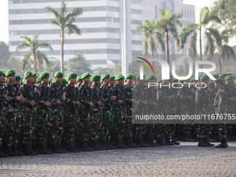 Thousands of armed forces and police personnel take part in a troop roll call at the National Monument in Jakarta, Indonesia, on October 18,...