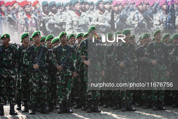 Thousands of armed forces and police personnel take part in a troop roll call at the National Monument in Jakarta, Indonesia, on October 18,...