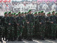 Thousands of armed forces and police personnel take part in a troop roll call at the National Monument in Jakarta, Indonesia, on October 18,...