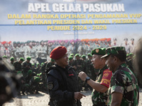 Thousands of armed forces and police personnel take part in a troop roll call at the National Monument in Jakarta, Indonesia, on October 18,...