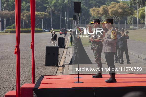 Indonesian Chief of Armed Forces, General Agus Subianto, and Police Chief, General Listyo Sigit Prabowo, lead the roll call of troops at the...