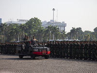 TNI Commander General Agus Subianto (right) and National Police Chief General Listyo Sigit Prabowo (left) inspect troops while leading a joi...