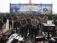 TNI Commander General Agus Subianto (left) and National Police Chief General Listyo Sigit Prabowo (right) speak during the press conference...