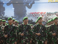 Thousands of armed forces and police personnel take part in a troop roll call at the National Monument in Jakarta, Indonesia, on October 18,...