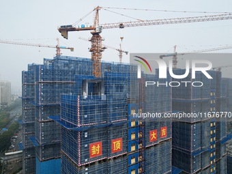 A newly built residential complex is shown in Hangzhou, China, on October 17, 2024. According to data released by the National Bureau of Sta...