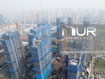 A newly built residential complex is shown in Hangzhou, China, on October 17, 2024. According to data released by the National Bureau of Sta...