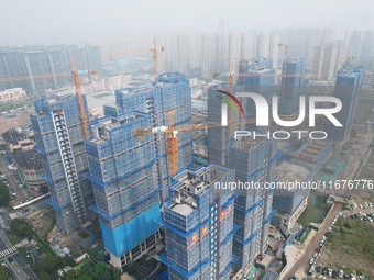 A newly built residential complex is shown in Hangzhou, China, on October 17, 2024. According to data released by the National Bureau of Sta...