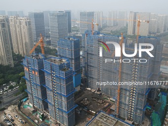 A newly built residential complex is shown in Hangzhou, China, on October 17, 2024. According to data released by the National Bureau of Sta...