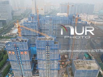 A newly built residential complex is shown in Hangzhou, China, on October 17, 2024. According to data released by the National Bureau of Sta...