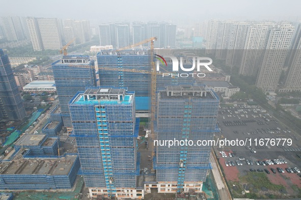 A newly built residential complex is shown in Hangzhou, China, on October 17, 2024. According to data released by the National Bureau of Sta...