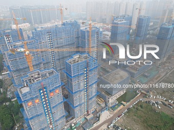 A newly built residential complex is shown in Hangzhou, China, on October 17, 2024. According to data released by the National Bureau of Sta...