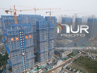 A newly built residential complex is shown in Hangzhou, China, on October 17, 2024. According to data released by the National Bureau of Sta...