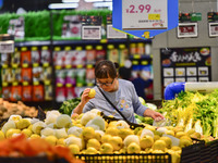 Consumers shop at a supermarket in Qingzhou, China, on October 13, 2024. On October 13, 2024, data released by the National Bureau of Statis...