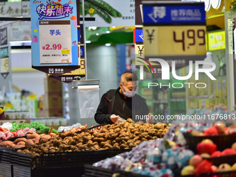 Consumers shop at a supermarket in Qingzhou, China, on October 13, 2024. On October 13, 2024, data released by the National Bureau of Statis...