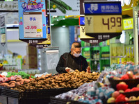 Consumers shop at a supermarket in Qingzhou, China, on October 13, 2024. On October 13, 2024, data released by the National Bureau of Statis...