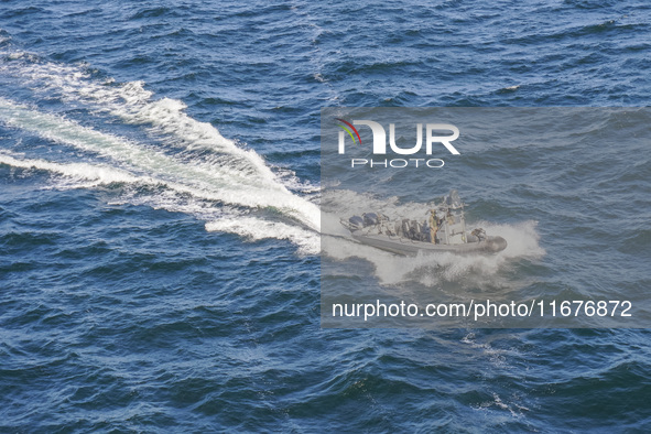 In Gdynia, Poland, on July 31, 2024, Naval Special Operations Unit Formoza soldiers escort a StenaLine ferry on its way from Gdynia, Poland,...