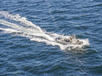 In Gdynia, Poland, on July 31, 2024, Naval Special Operations Unit Formoza soldiers escort a StenaLine ferry on its way from Gdynia, Poland,...