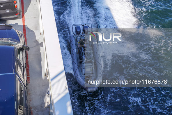 In Gdynia, Poland, on July 31, 2024, Naval Special Operations Unit Formoza soldiers escort a StenaLine ferry on its way from Gdynia, Poland,...