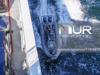 In Gdynia, Poland, on July 31, 2024, Naval Special Operations Unit Formoza soldiers escort a StenaLine ferry on its way from Gdynia, Poland,...