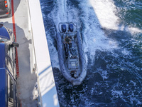 In Gdynia, Poland, on July 31, 2024, Naval Special Operations Unit Formoza soldiers escort a StenaLine ferry on its way from Gdynia, Poland,...