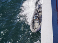 In Gdynia, Poland, on July 31, 2024, Naval Special Operations Unit Formoza soldiers escort a StenaLine ferry on its way from Gdynia, Poland,...