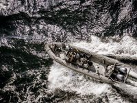 In Gdynia, Poland, on July 31, 2024, Naval Special Operations Unit Formoza soldiers escort a StenaLine ferry on its way from Gdynia, Poland,...