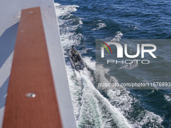 In Gdynia, Poland, on July 31, 2024, Naval Special Operations Unit Formoza soldiers escort a StenaLine ferry on its way from Gdynia, Poland,...