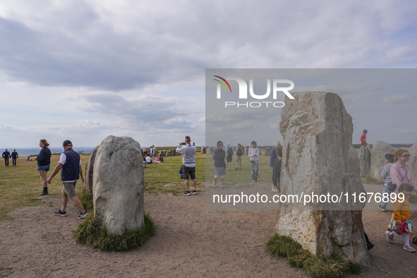 People visit Ales Stenar, also called the Swedish Stonehenge, in Kaseberga, near Ystad, Scane, Sweden, on August 3, 2024. Ales Stenar is a m...