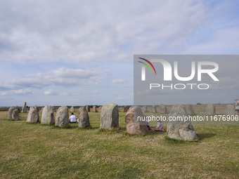 People visit Ales Stenar, also called the Swedish Stonehenge, in Kaseberga, near Ystad, Scane, Sweden, on August 3, 2024. Ales Stenar is a m...