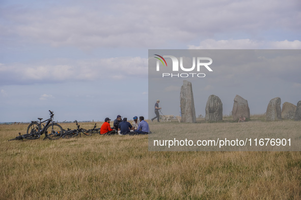 People visit Ales Stenar, also called the Swedish Stonehenge, in Kaseberga, near Ystad, Scane, Sweden, on August 3, 2024. Ales Stenar is a m...