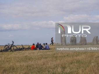 People visit Ales Stenar, also called the Swedish Stonehenge, in Kaseberga, near Ystad, Scane, Sweden, on August 3, 2024. Ales Stenar is a m...