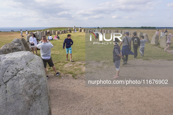 People visit Ales Stenar, also called the Swedish Stonehenge, in Kaseberga, near Ystad, Scane, Sweden, on August 3, 2024. Ales Stenar is a m...