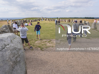 People visit Ales Stenar, also called the Swedish Stonehenge, in Kaseberga, near Ystad, Scane, Sweden, on August 3, 2024. Ales Stenar is a m...