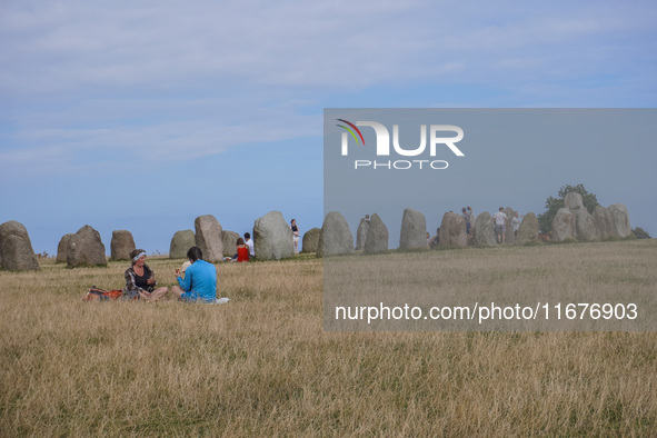 People visit Ales Stenar, also called the Swedish Stonehenge, in Kaseberga, near Ystad, Scane, Sweden, on August 3, 2024. Ales Stenar is a m...