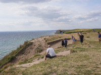 People visit Ales Stenar, also called the Swedish Stonehenge, in Kaseberga, near Ystad, Scane, Sweden, on August 3, 2024. Ales Stenar is a m...