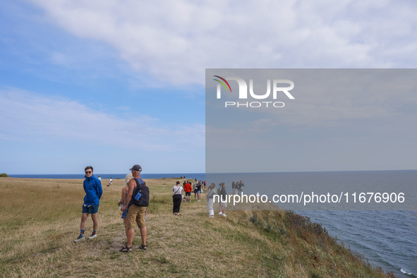 People visit Ales Stenar, also called the Swedish Stonehenge, in Kaseberga, near Ystad, Scane, Sweden, on August 3, 2024. Ales Stenar is a m...