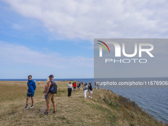 People visit Ales Stenar, also called the Swedish Stonehenge, in Kaseberga, near Ystad, Scane, Sweden, on August 3, 2024. Ales Stenar is a m...