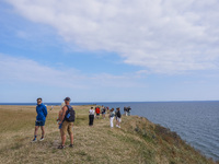 People visit Ales Stenar, also called the Swedish Stonehenge, in Kaseberga, near Ystad, Scane, Sweden, on August 3, 2024. Ales Stenar is a m...