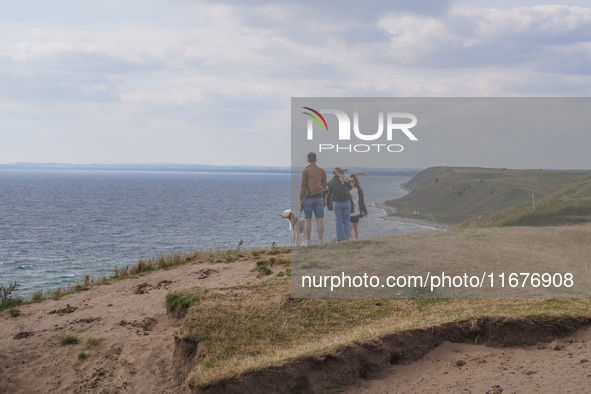 People visit Ales Stenar, also called the Swedish Stonehenge, in Kaseberga, near Ystad, Scane, Sweden, on August 3, 2024. Ales Stenar is a m...