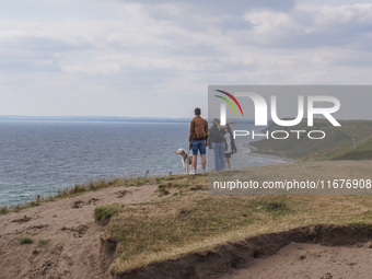 People visit Ales Stenar, also called the Swedish Stonehenge, in Kaseberga, near Ystad, Scane, Sweden, on August 3, 2024. Ales Stenar is a m...