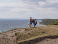 People visit Ales Stenar, also called the Swedish Stonehenge, in Kaseberga, near Ystad, Scane, Sweden, on August 3, 2024. Ales Stenar is a m...